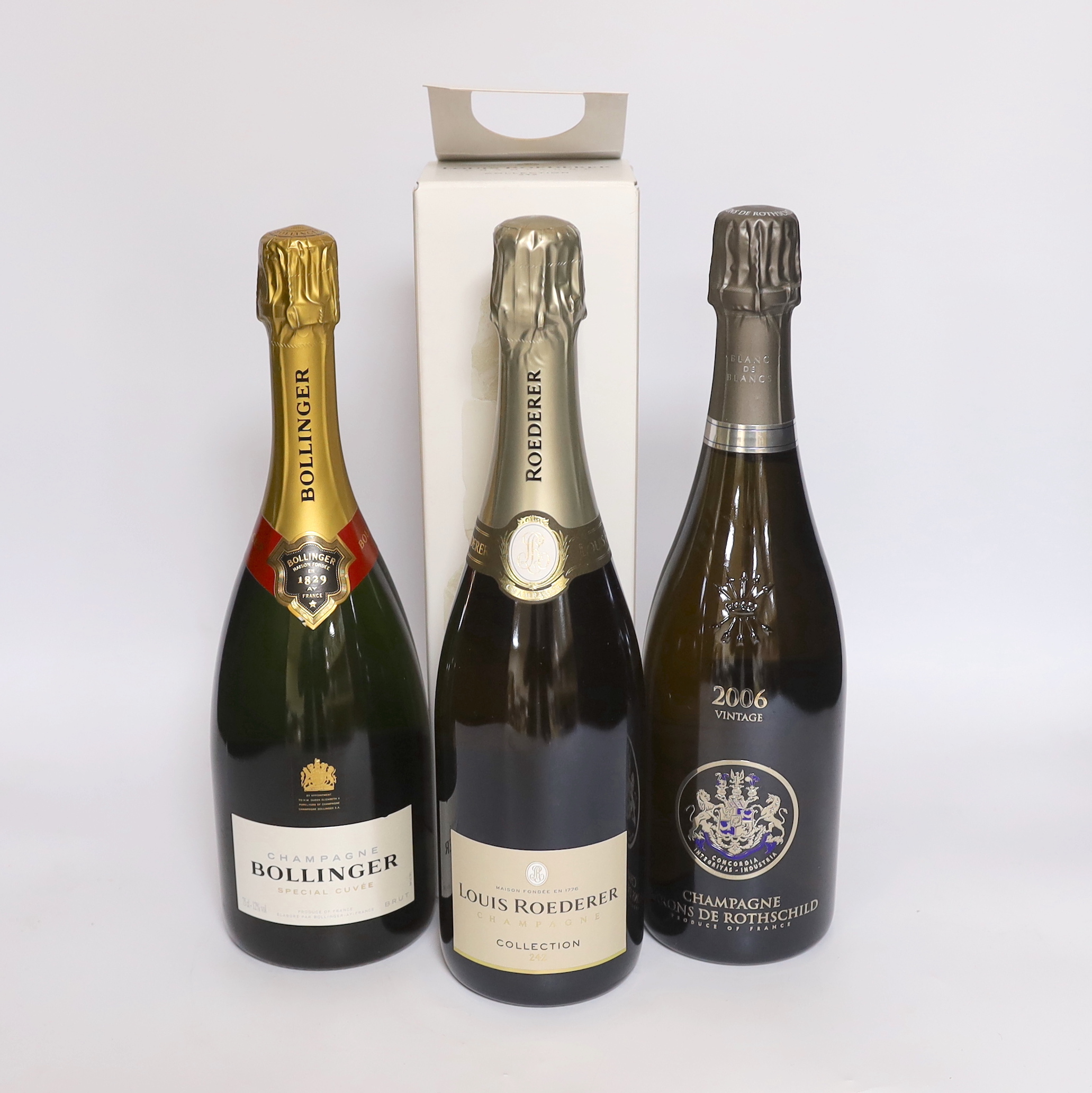 Three bottles of champagne - a bottle of Bollinger special cuvée, a bottle of champagne barons de Rothschild 2006 and a cased bottle of Louis Roederer collection 242